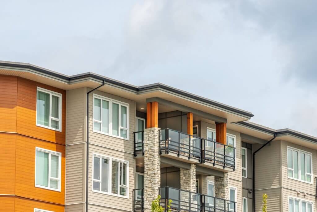 Far view of the front of an apartment complex | multi-family building roofing